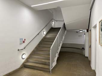 A photograph looking up at the stairs from the basement at Tate Liverpool