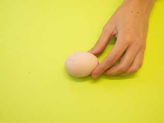whitened egg in a hand 